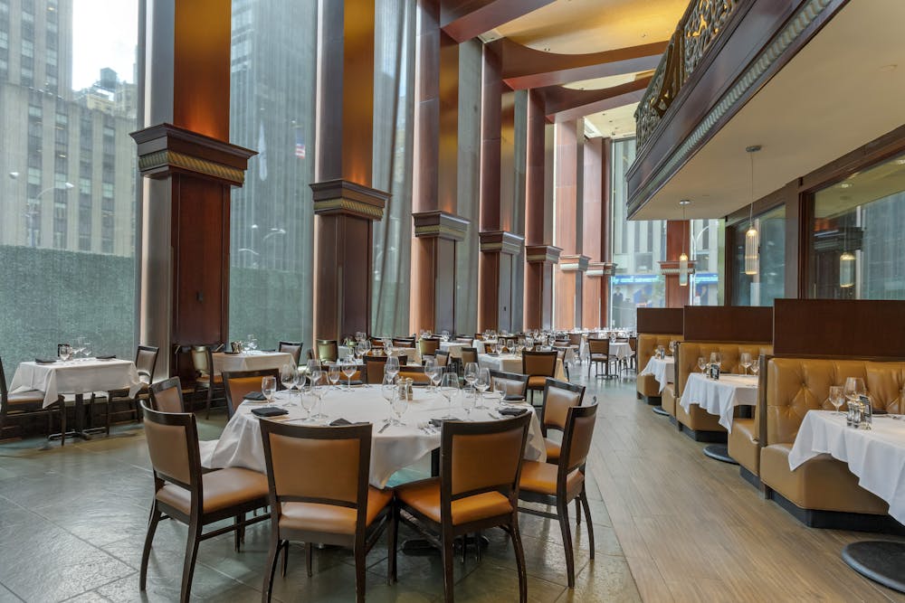 a room filled with furniture and a large window